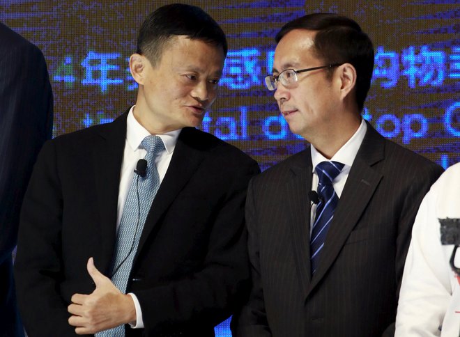 FILE PHOTO: Alibaba Founder and Chairman Jack Ma (L) talks to CEO Daniel Zhang at NYSE Bell Ringing ceremony during Alibaba Group's 11.11 Global shopping festival in Beijing, China, November 11, 2015.  REUTERS/Kim Kyung-Hoon/File Photo