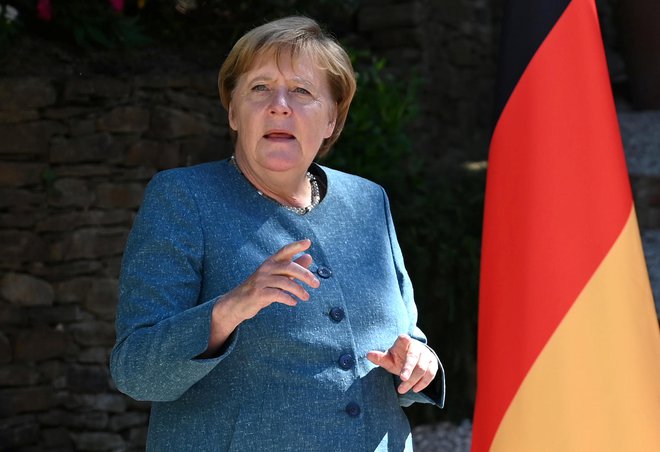 Nemška kanclerka Angela Merkel je zadovoljna. FOTO: Christophe Simon / REUTERS