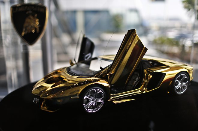 A gold Lamborghini model is on display at the Lamborghini showroom in Dubai September 19, 2013. A prototype of a model Lamborghini that will be made of 500 kg of gold and diamonds is now on display in a showroom in Dubai, the first stop ahead of a world t