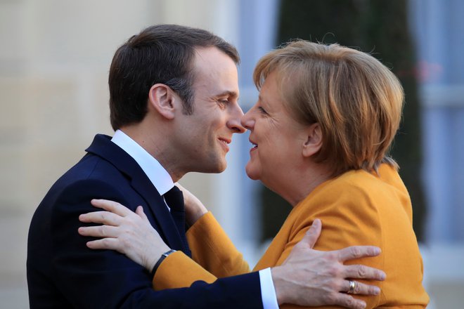 Emmanuel Macron in Angela Merkel.