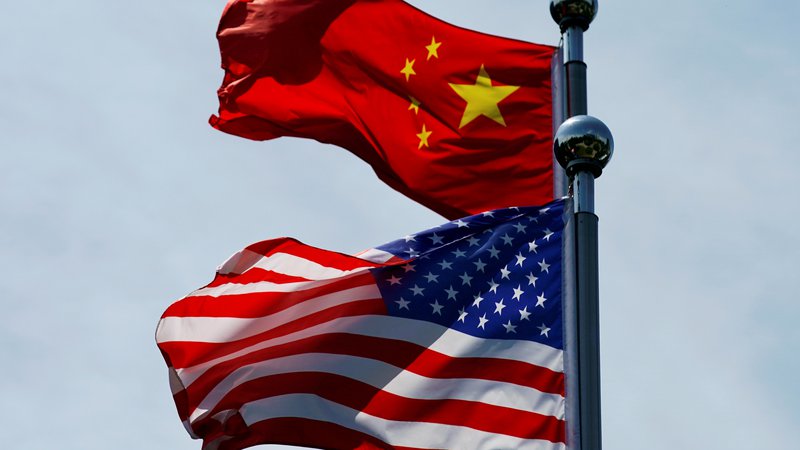 Fotografija: Iniciativa za razvoj in testiranja centralne digitalne valute na kitajskem je dodatno zaostrila spore med ZDA in azijsko velesilo. FOTO: Aly Song/Reuters