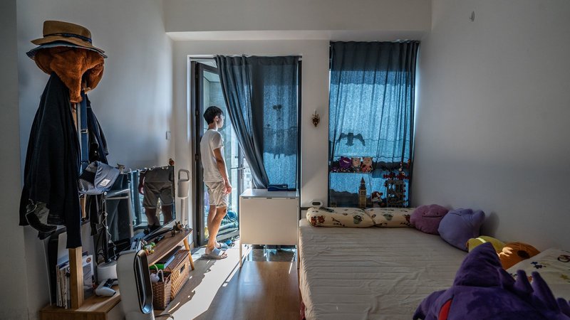 Fotografija: Življenje v hongkonških mikro stanovanjih. Foto: Lam Yik / Bloomberg
